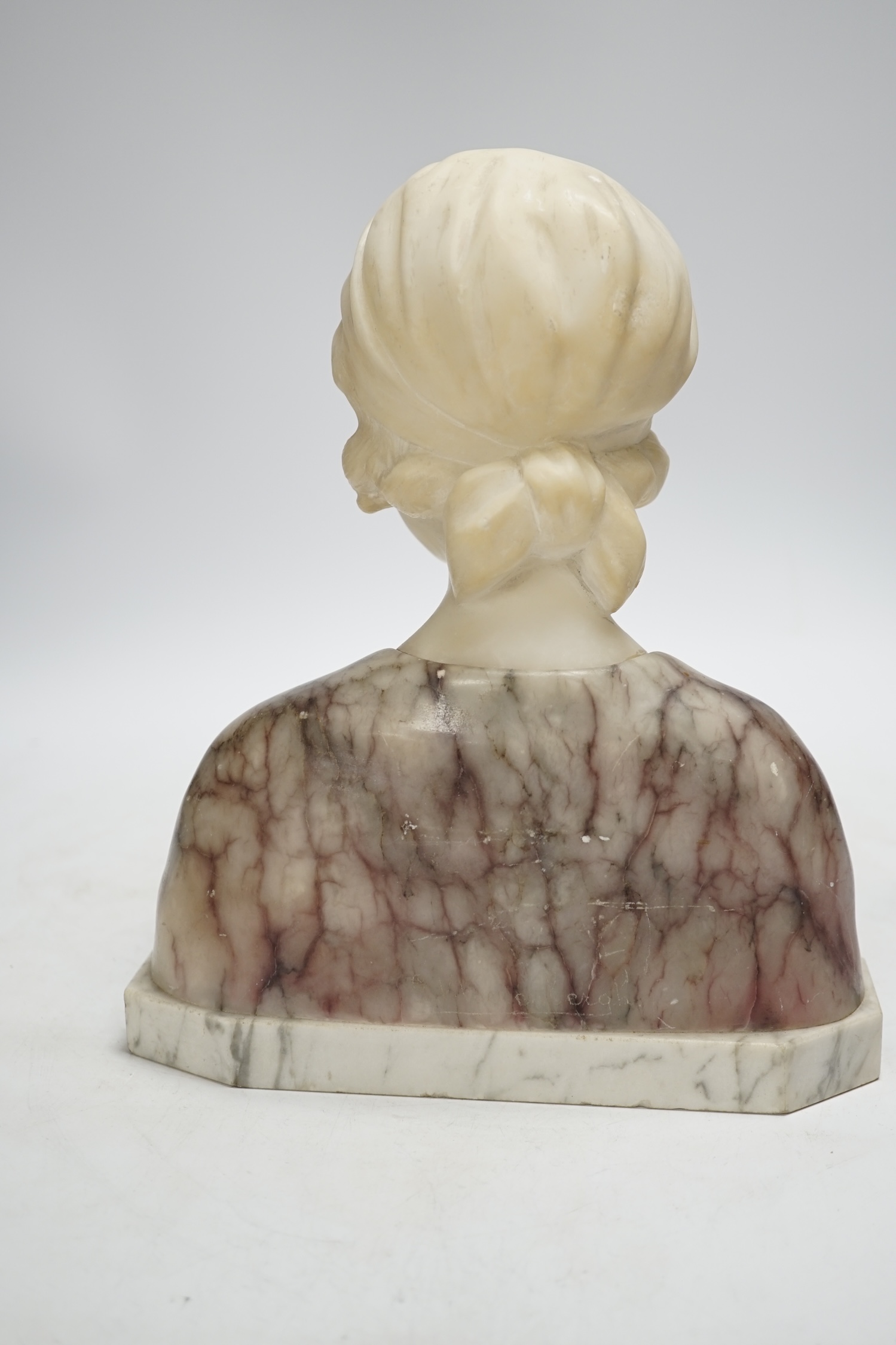Gustave Van Vaerenbergh (1873-1927), an alabaster bust of a lady, applied plaque, signed to the reverse, 26cm high